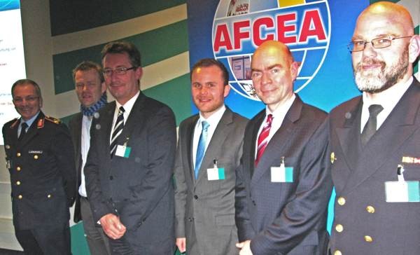 At the podium during the chapter's 96th expert symposium are (l-r) Maj. Gen. Erich Staudacher, GE A, chapter president; Dr. Jens Woch, Information Technology Office of the Armed Forces; Juergen Grundau, IABG; Michael Mohr, Information Technology Office of the Armed Forces; Raimund Richter, Thales; and Capt. Goetz Stuck, GE N, chapter member.